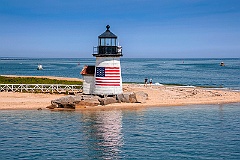 Nantucket Island Lighthouse with American Flag on Quiet Summer D